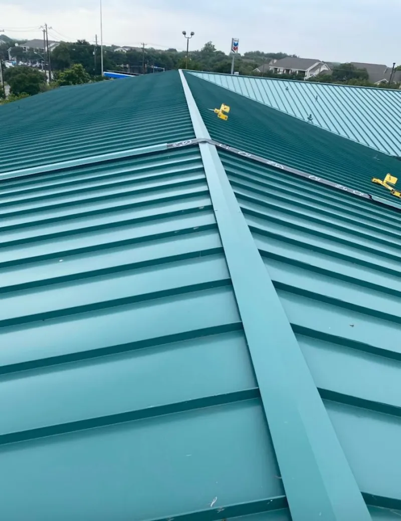 Green commercial metal roof ridge and valley for Metal Roof Repair in Woodmoor